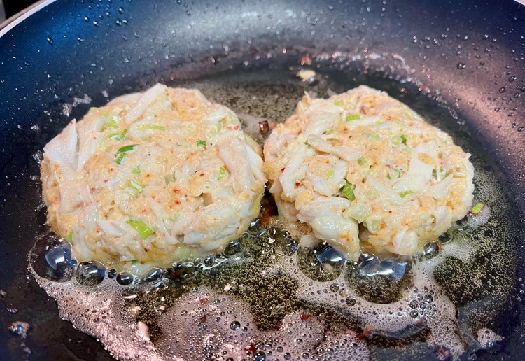 Image of Over medium heat, add oil to your pan to up ¼” deep and drop in a little breadcrumb to test.  The oil should be simmering.
